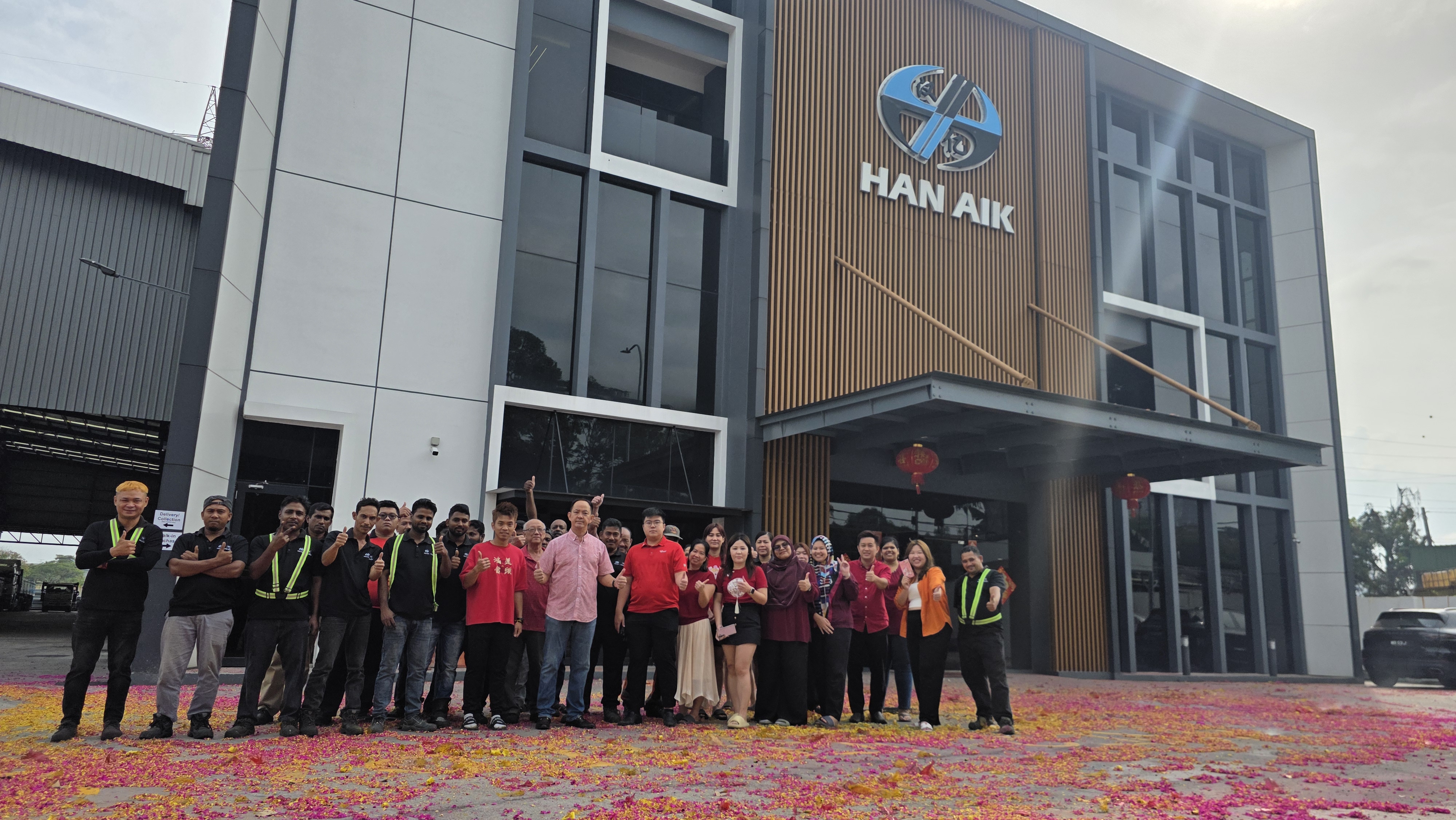 Han Aik Hardware team outside the Johor Bahru company building