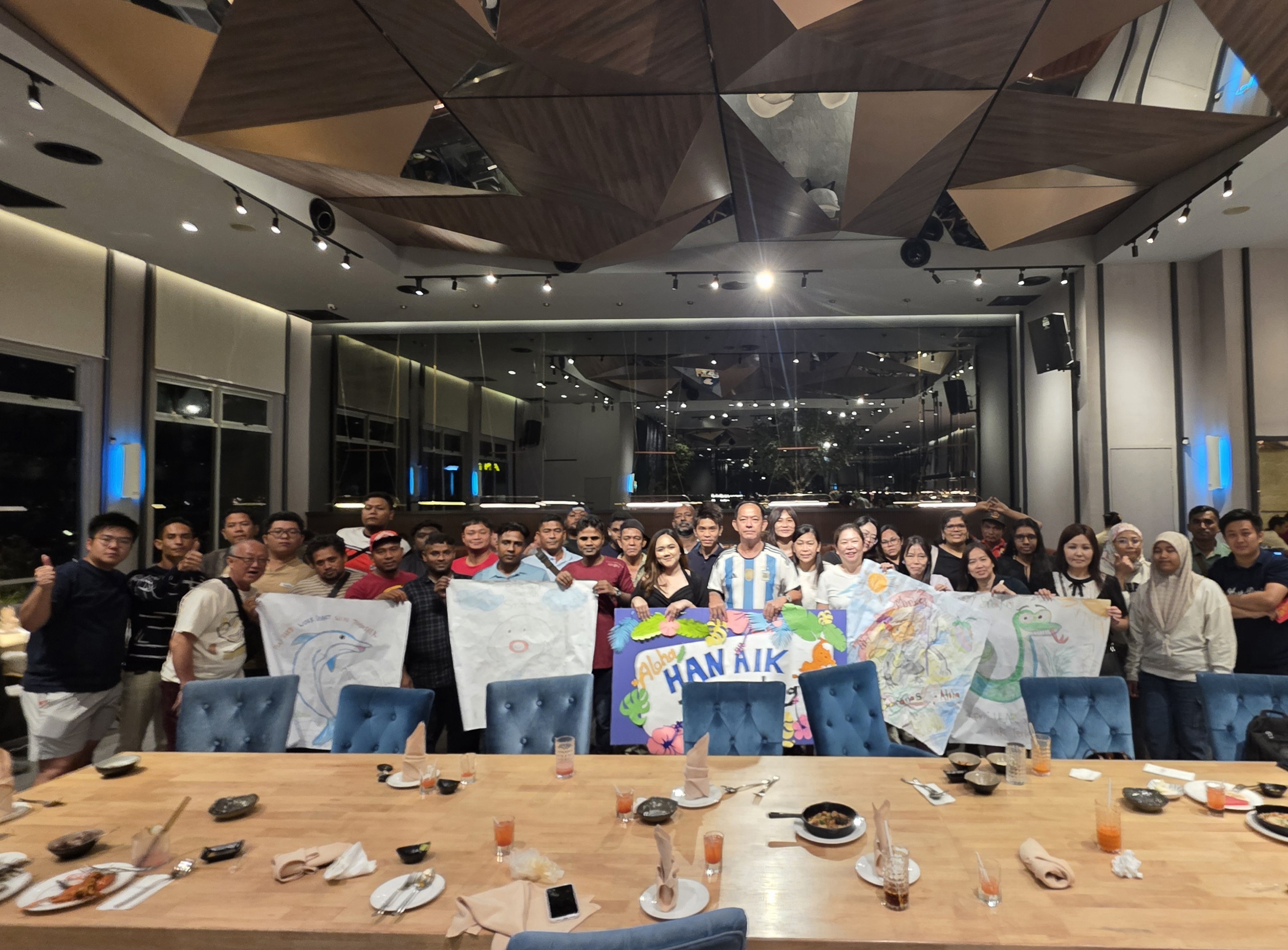 Han Aik Hardware staff at a team-building dinner